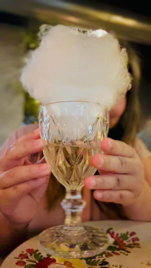 Sparkling Wine topped with cotton candy at Penelope a Casa in Milan