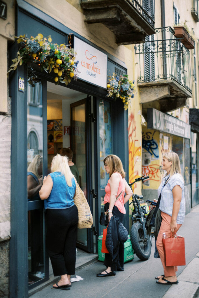 women buying cannoli in Milan