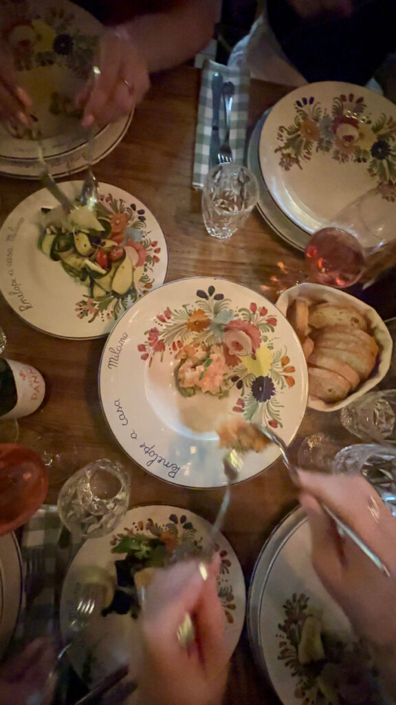 Sharing plates of food at Penelope a Casa in Milan