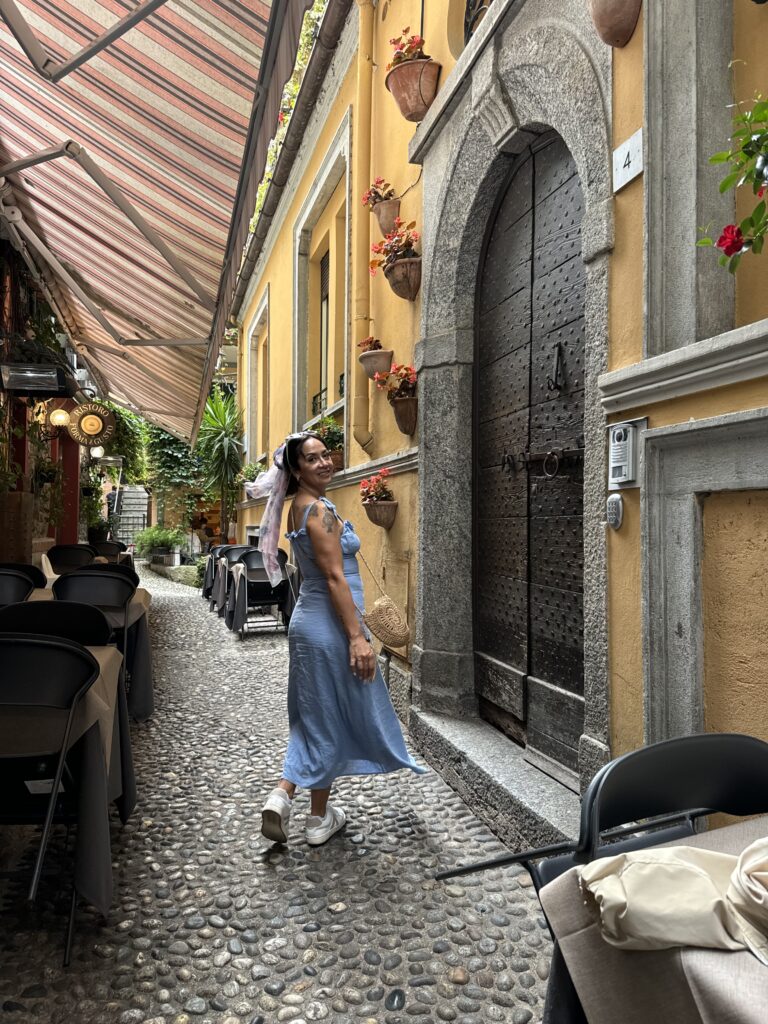 a woman walking in Lake Como