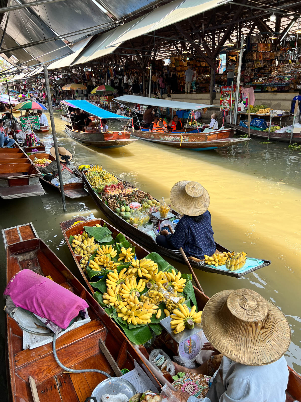 Boats loaded with fruit at a floating market in Thailand