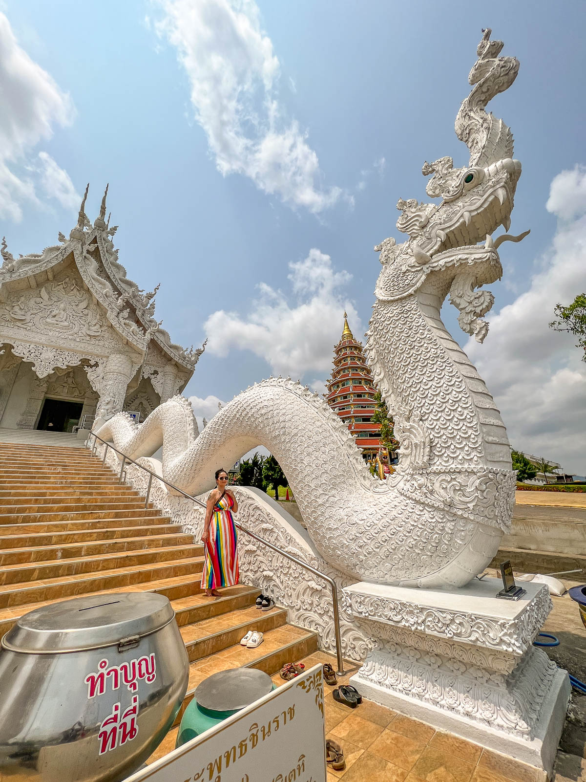 A white serpent staircase at a temple in Thailand