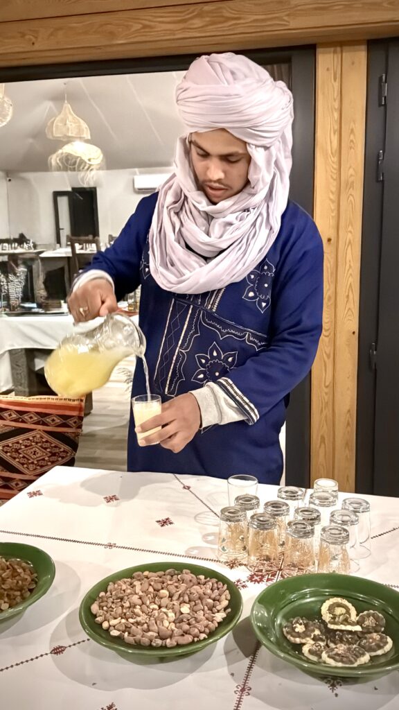 Desert Nomad pouring tea into a cup.