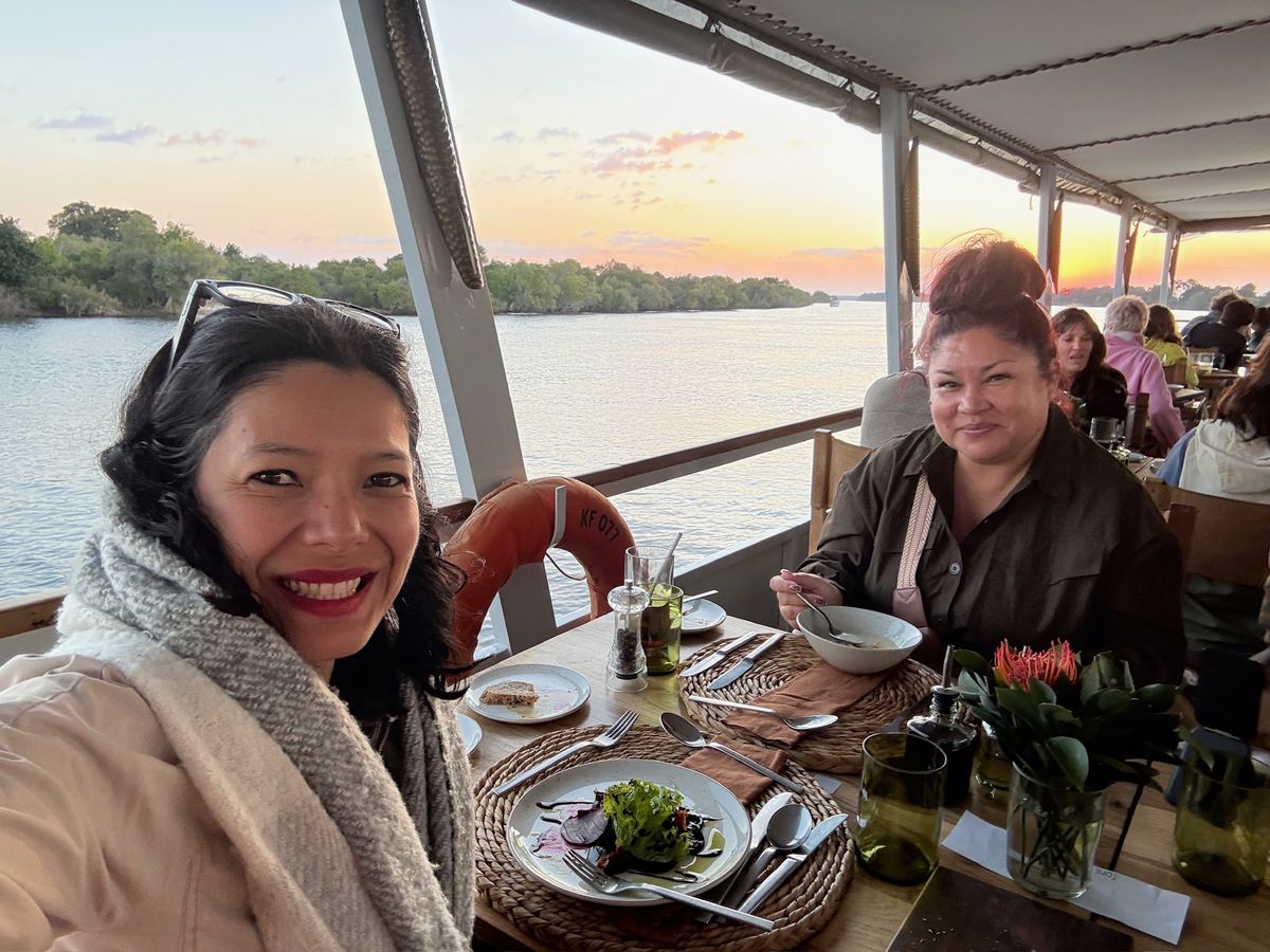 Two women at a table on the Zambezi cruise with a salad and soup