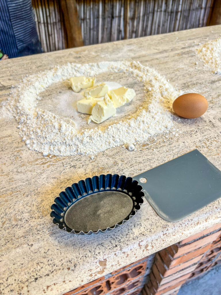 Fresh pasta dough and flour on a marble counter during the cooking class at the Amalfi Lemon Experience.