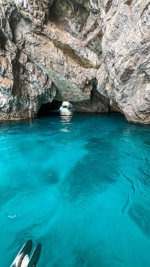 Bright turquoise water inside a sea grotto at Capri.