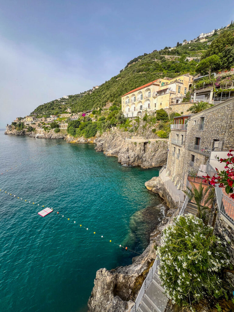 Looking down on a turquoise cove from Hotel Marmorata, with the coast stretching into the distance.
