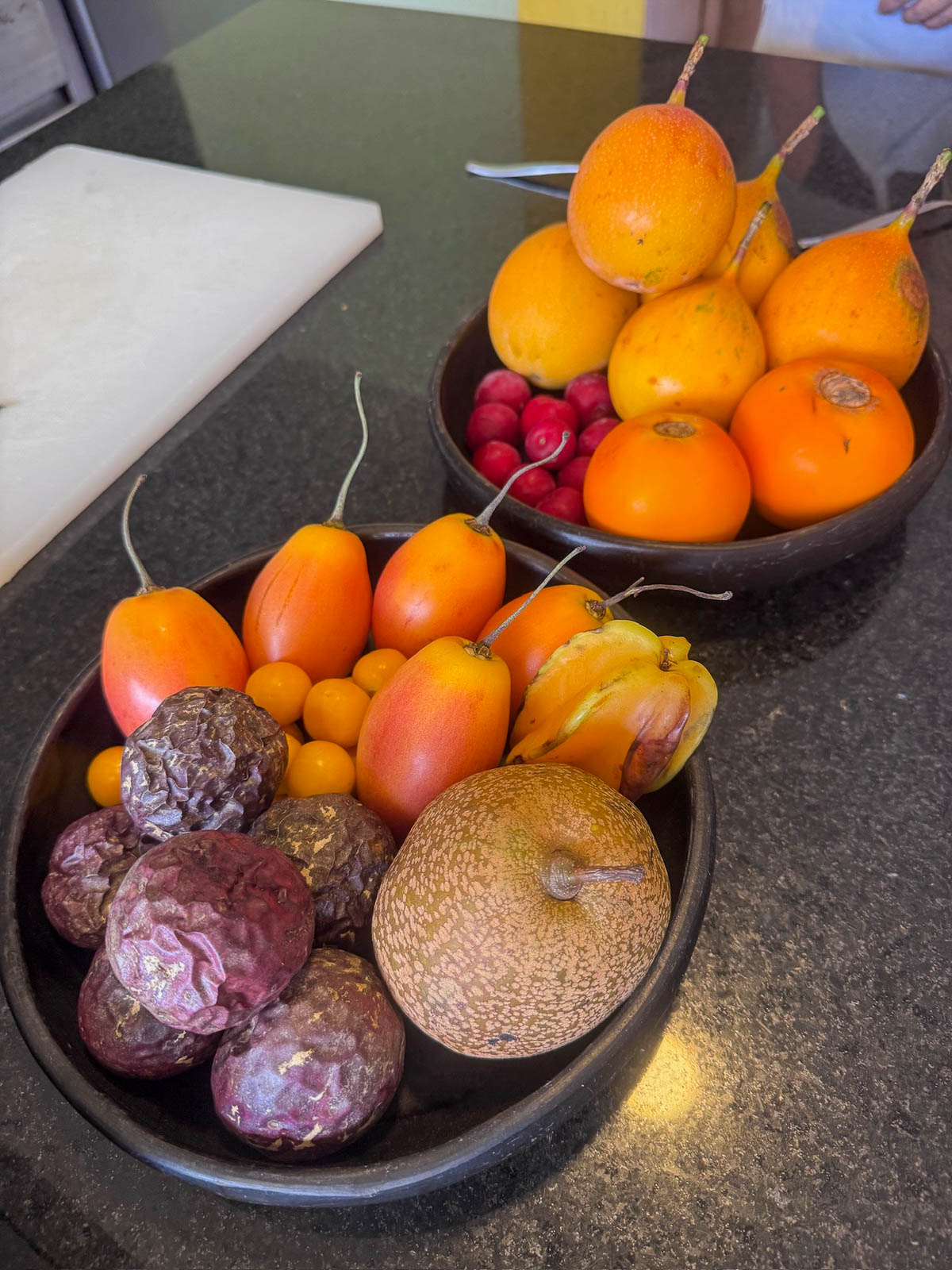 Bowls of exotic Colombian fruits including granadilla and tamarillo at our cooking class