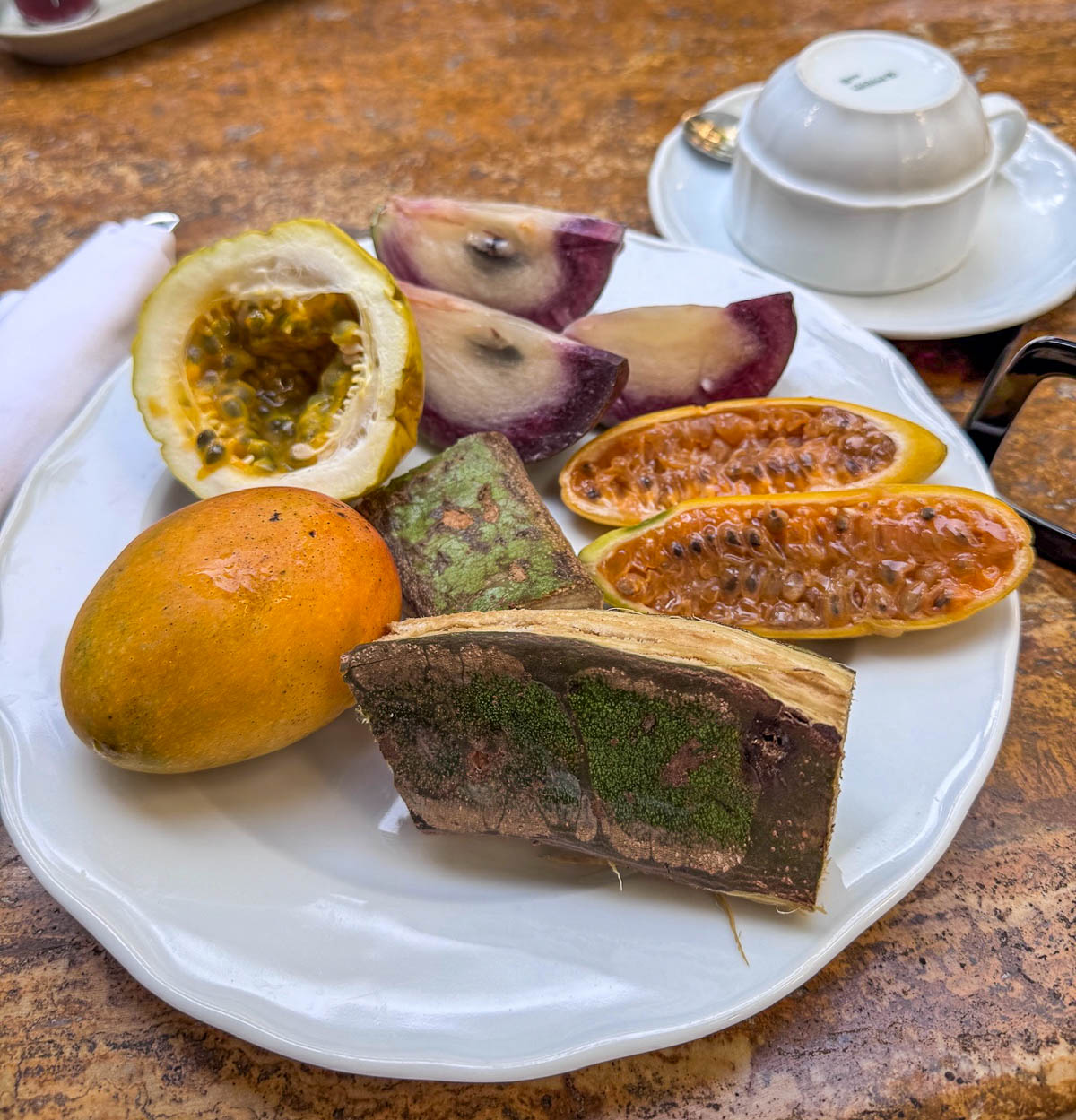 Plate of exotic Colombian fruits cut open for tasting