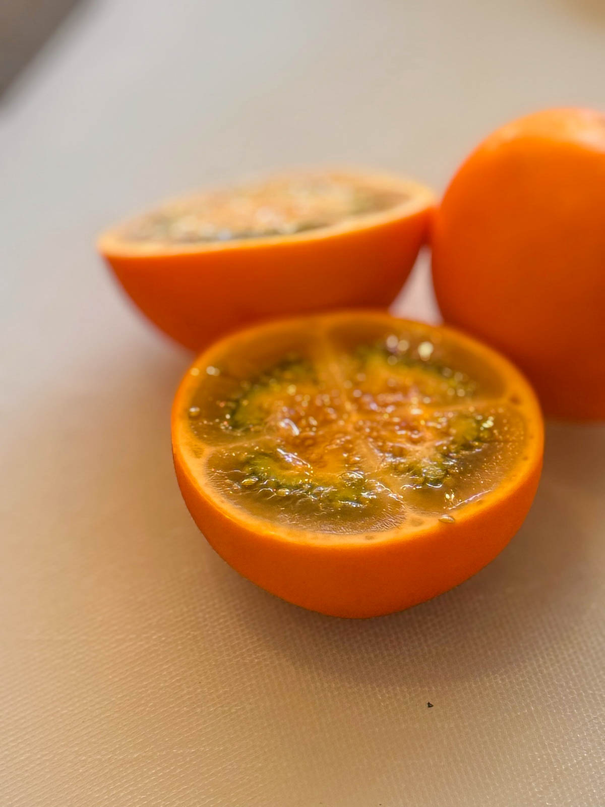 Lulo fruit cut in half on a plate