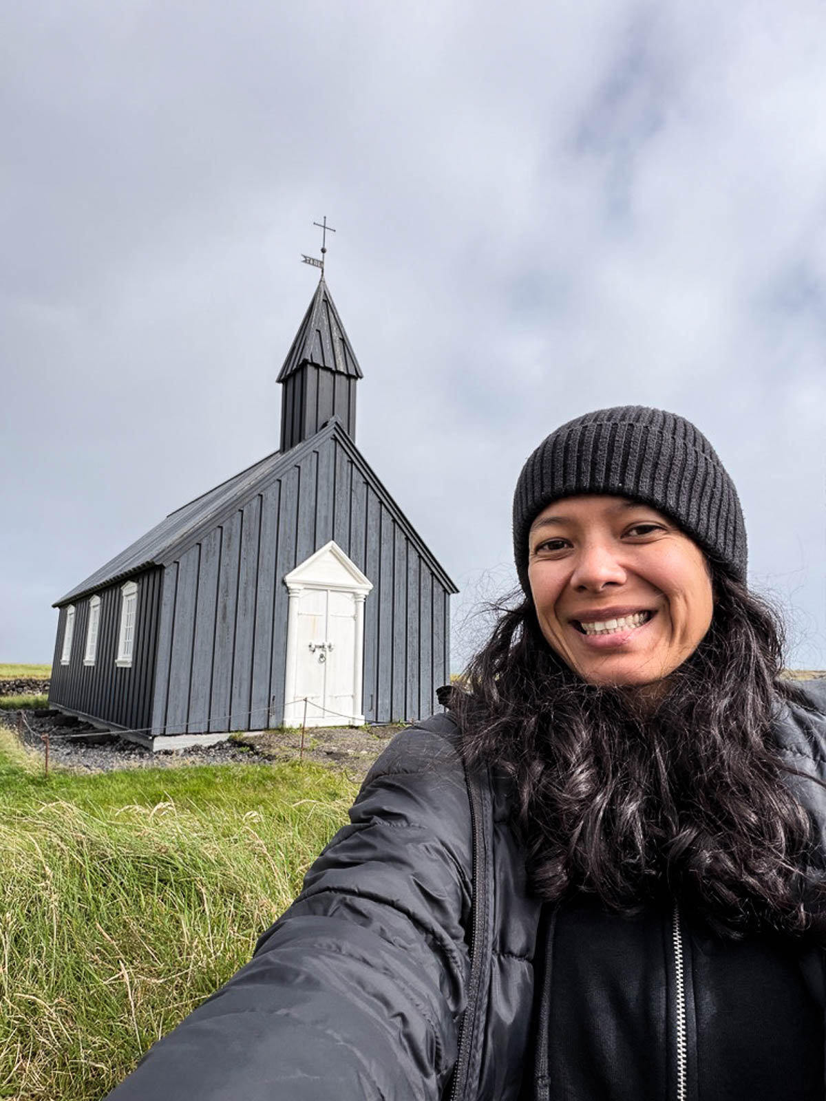 Toni taking a selfie in front of the black church at Búðir on the Snæfellsnes Peninsula