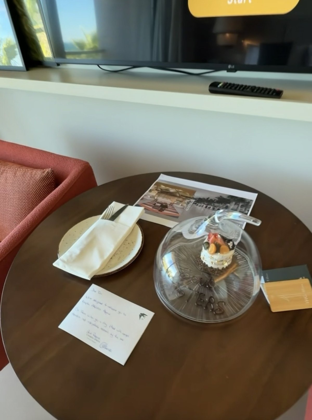Welcome treat and handwritten note on the desk in our room at Kimpton Atlântico Algarve