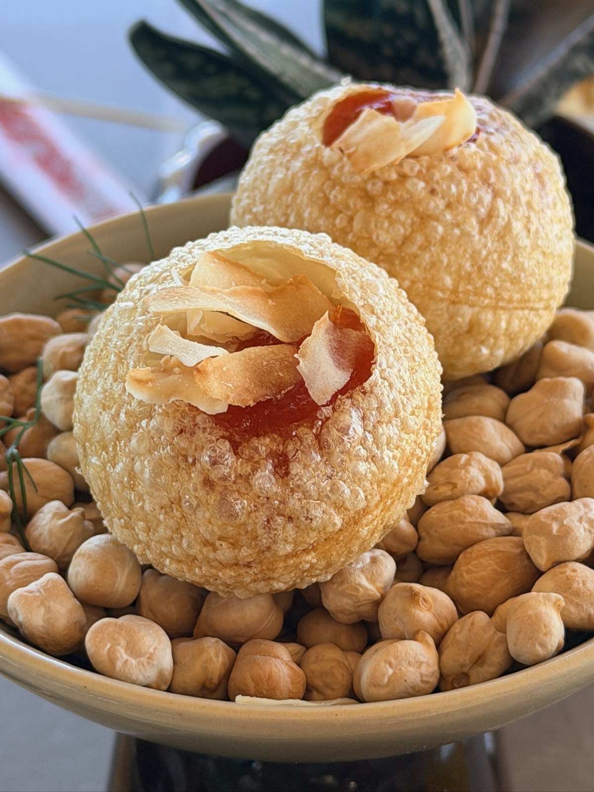 Crispy filled puffs served on a bed of chickpeas at Zénite Rooftop