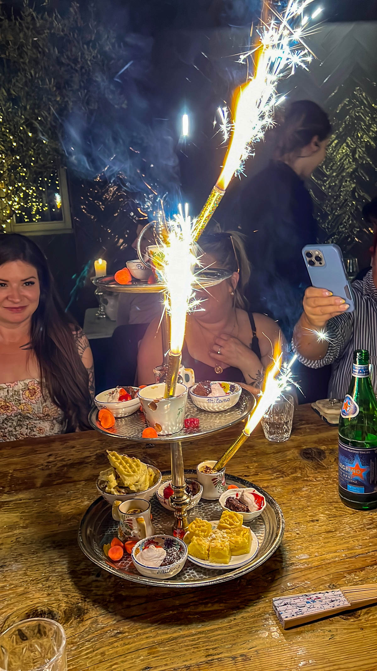 A dessert with a lit sparkler at Penelope a Casa in Milan
