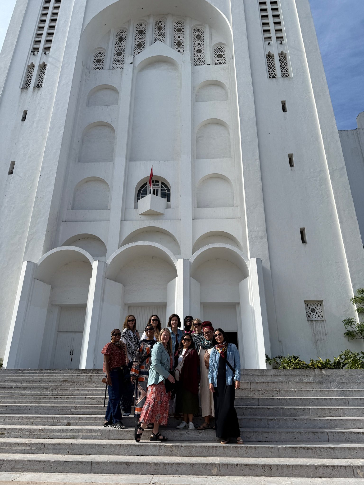 Group of women on the steps of the white Sacré Coeur cathedral in Casablanca