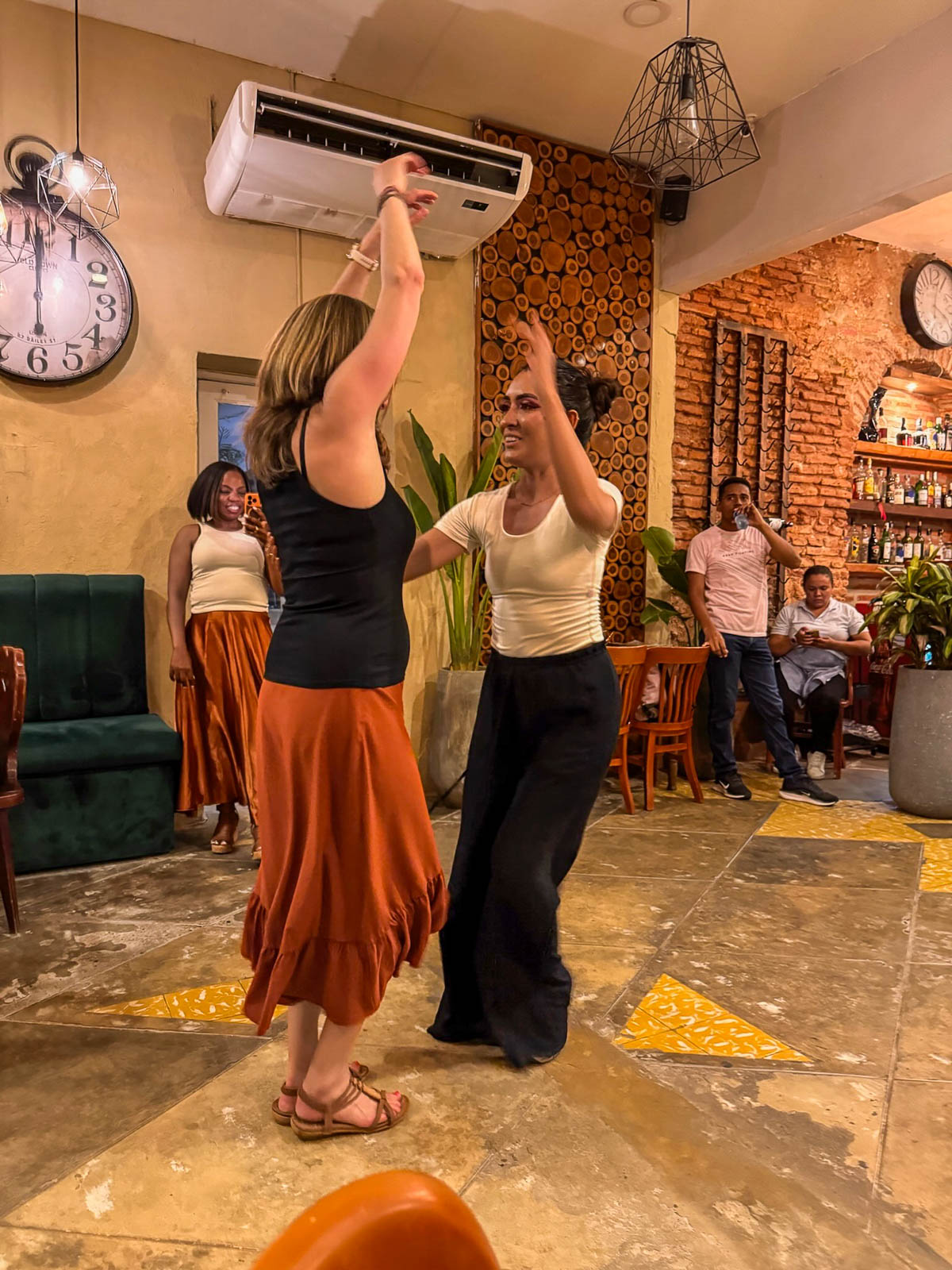 Two women dancing during our salsa lesson in Cartagena